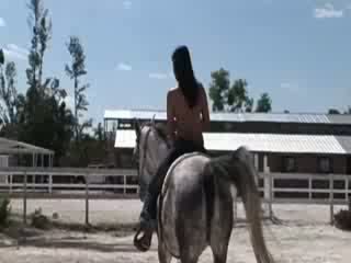 Chick from Thailand riding a horse