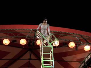 Gorgeous Chinese Girl Performing Death Defying Stunt.