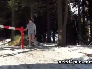 Crazy half naked chick pissing in snow